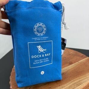 Dock & Bay quick-dry towel in its blue carrying pouch